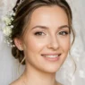 Bride with natural flawless makeup showing soft romantic bridal look in clean studio lighting