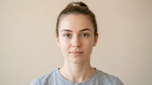 Woman's natural makeup-free face showing clean skin before clown makeup transformation begins
