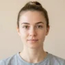 Woman's natural makeup-free face showing clean skin before clown makeup transformation begins
