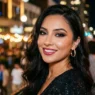 Woman with dramatic evening smokey eye makeup and warm city lighting behind her