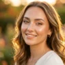 Woman with glowing summer makeup in golden hour light showing dewy skin and subtle highlighting