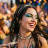 Woman with vibrant colorful makeup at outdoor festival with warm lighting and bokeh background