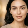Woman with a flawless no-makeup makeup look, skin-toned lip and single coat of mascara, soft diffused light