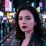 Woman with dark plum lips and pale porcelain skin under pink and blue neon city lights at night
