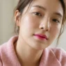 Woman wearing blurred pink gradient lips with deeper centre in soft daylight